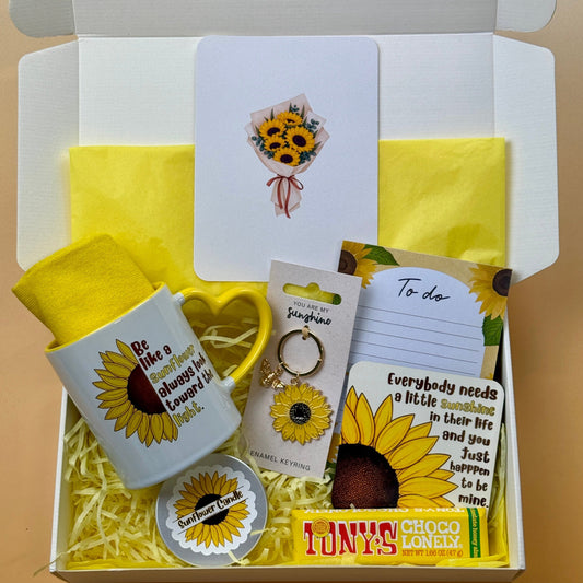 Sunflower gift box with sunflower mug, cozy yellow socks, candle, keyring, coaster, notepad, greeting card and Tony's Chocolonely chocolate