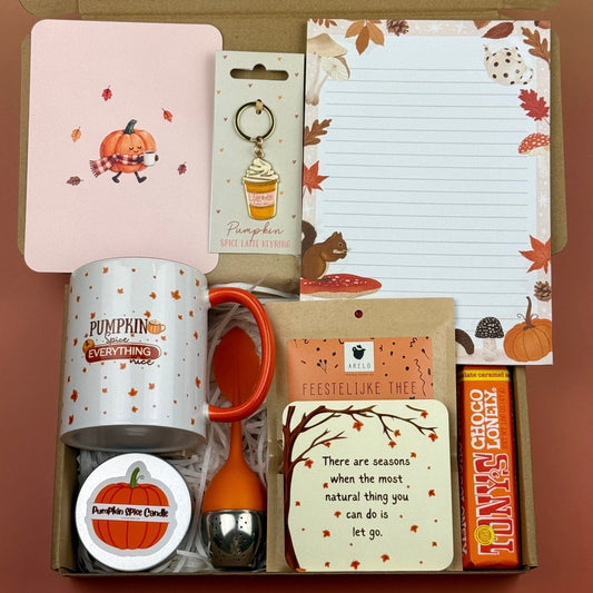 Pumpkin spice autumn gift box with mug, candle, tea infuser, notebook, coaster, chocolate and fall-themed accessories